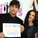 Photo: Ashton Kutcher & Demi Moore - Poster Slogan "Real Men don't Buy Girls"