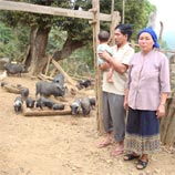 Chanthone Soutvadti with her husband and child at Nasala Village, Houaphan Province in Lao