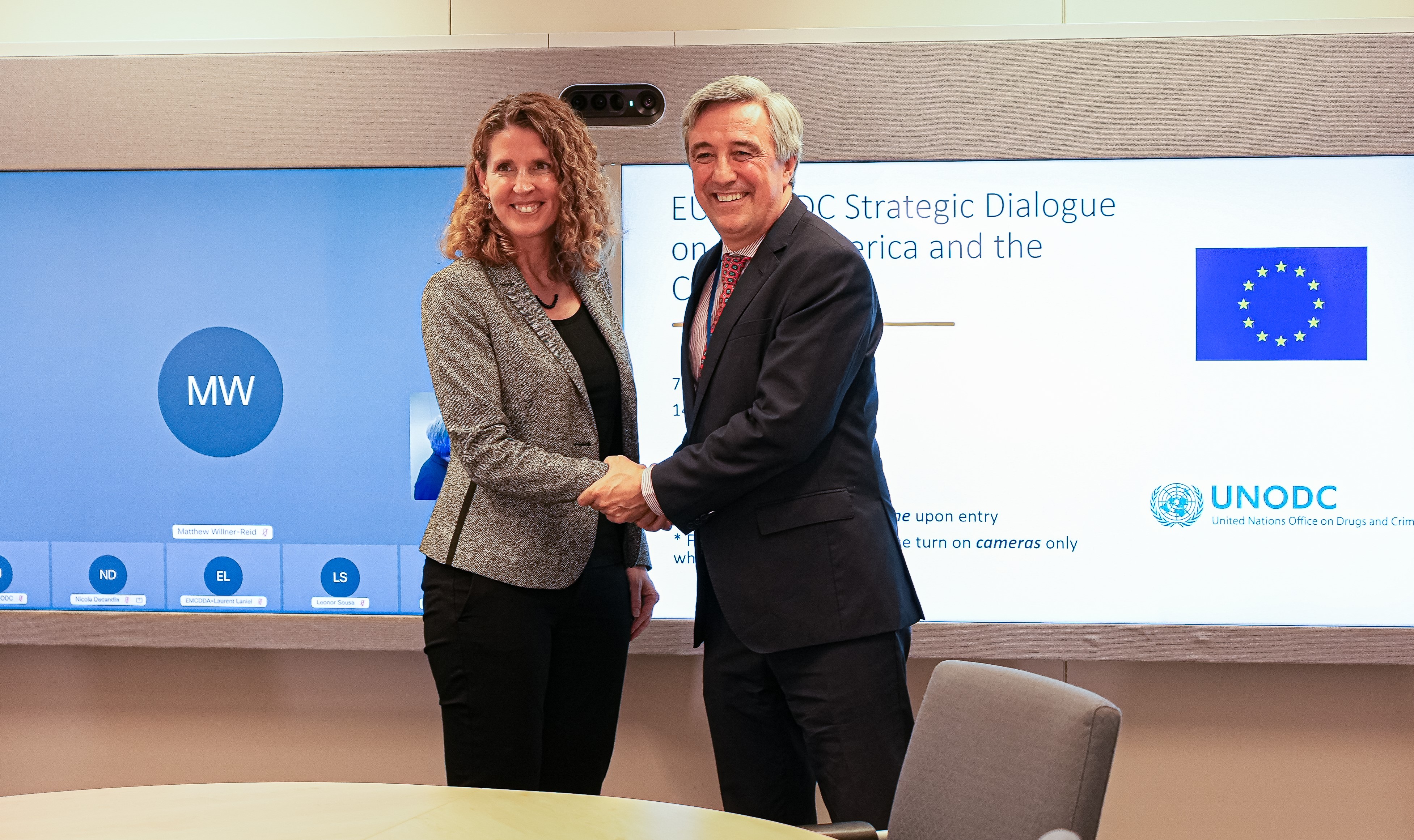 <em>Deputy Director of the Division for Operations of the United Nations Office on Drugs and Crime (UNODC) Candice Welsch and Deputy Managing Director for the Americas at the European External Action Service shake hands</em>