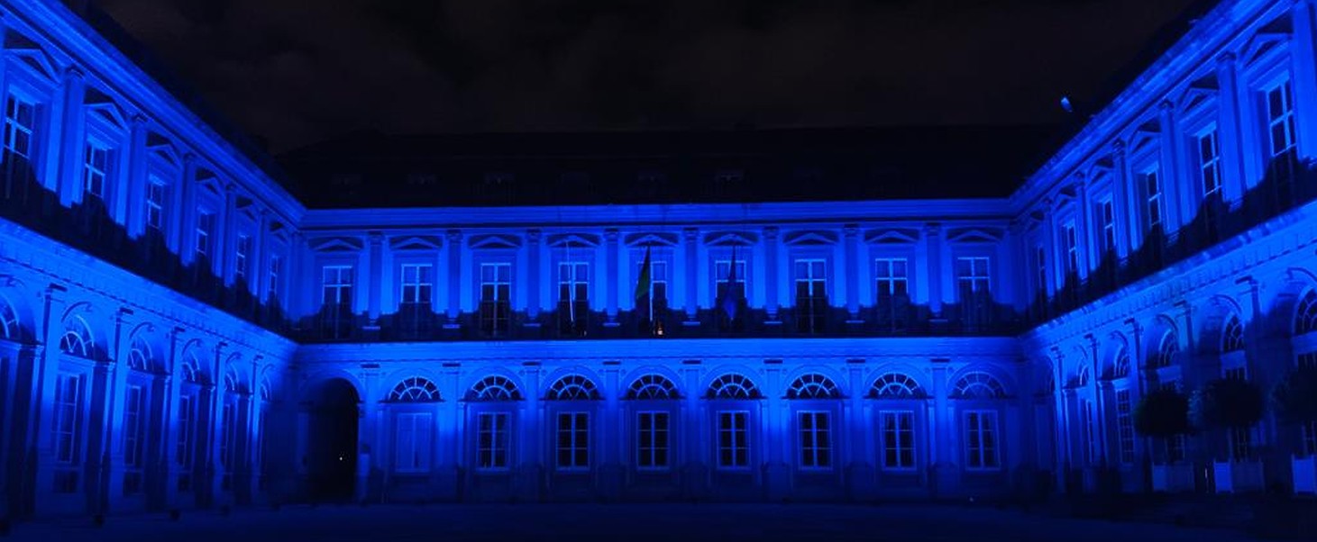 <em>Egmont Palace, Brussels, lit up blue to commemorate World Day Against Trafficking in Persons on 30 July 2021.</em>