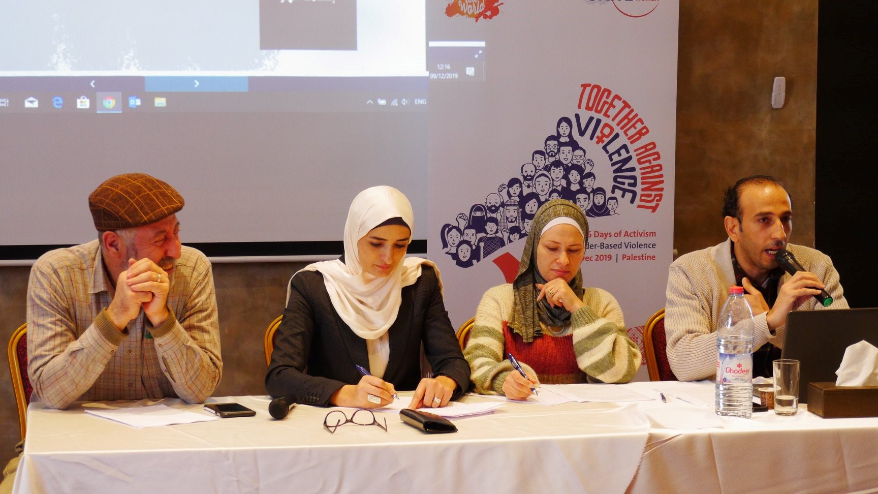 Two women and one men journliast take notes during
         the training. Journalist and Lecturer Said Abu Muallah (right) speaks about the importance of ethical reporting on gender
         justice and violence against women