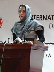 Ms. Hamida Batory Hussain, the essay competition first prize winner, reading out her essay in the event on 9 December 2013