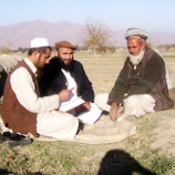Photo: UNODC Afghanistan: Abdul Basir Basirat (centre) during a monitoring exercise in Achin District, Afghanistan