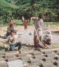 Local people build a water pipeline.