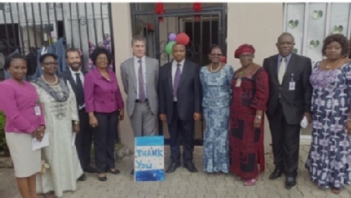  Alan Munday, First Secretary, Delegation of the European Union (EU) to Nigeria and ECOWAS (5th left); Director, Legal and Prosecution Department of NAPTIP, Abdulrahim Shaibu (5th right); and Country Representative of UNODC in Nigeria, Ms Mariam Sissoko (4th right) and Acting Director, Rehabilitation and Counselling Department of NAPTIP, Dr. Eunice Anuforom (4th left) and other dignitaries during the Commissioning Ceremony of the refurbished Abuja Shelter of the National Agency for the Prohibition of Trafficking in Persons and Other related Matters (NAPTIP). The repair works were undertaken within the framework of the EU funded project 'Promoting Better Management of Migration in Nigeria by Combating and Reducing Irregular Migration that occurs, inter alia, through Trafficking in Persons (TIP) and Smuggling of Migrants (SOM)' project being implemented by the United Nations Office on Drugs and Crime (UNODC). At the background is a 'Thank You' card presented to the EU by residents of the Shelter