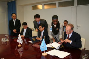 NHN representatives and Mr. Costa signing the agreement