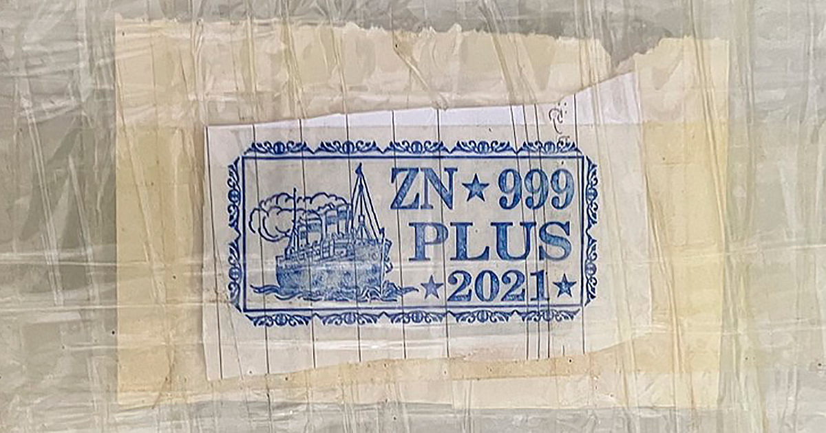 A package of seized opioids with a blue stamp.