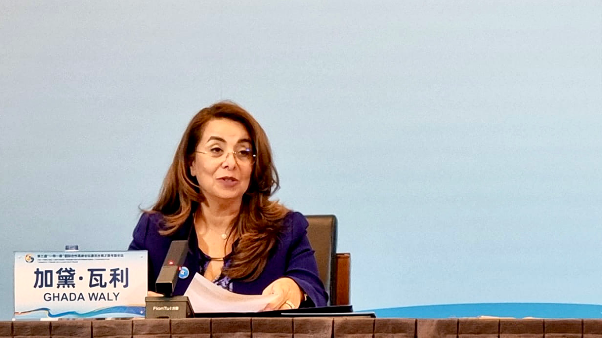 UNODC’s Executive Director, Ghada Waly, sits behind a desk as she delivers remarks during the ‘Clean Silk Road’ Thematic Forum in Beijing.