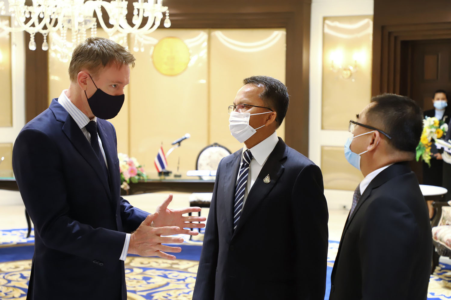 <p>Regional Representative Douglas discusses the UNODC pandemic response programme in Southeast Asia with Minister of Justice Somsak Thepsuthinand Permanent Secretary of Justice Wisit Wisitsoraat</p>